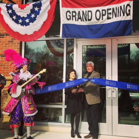 opening of a store - man and women cutting ribbon 